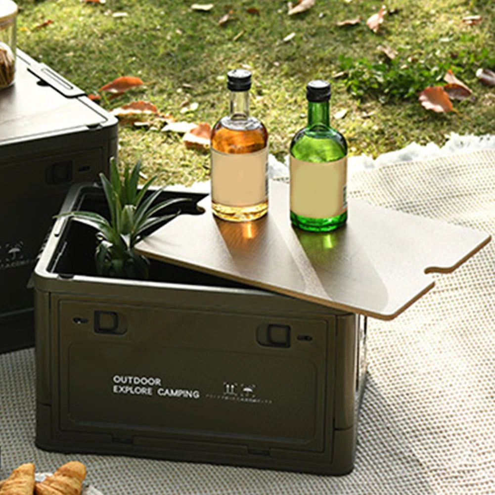 Green collapsible storage bin with lid opened, showing bottles and snacks inside