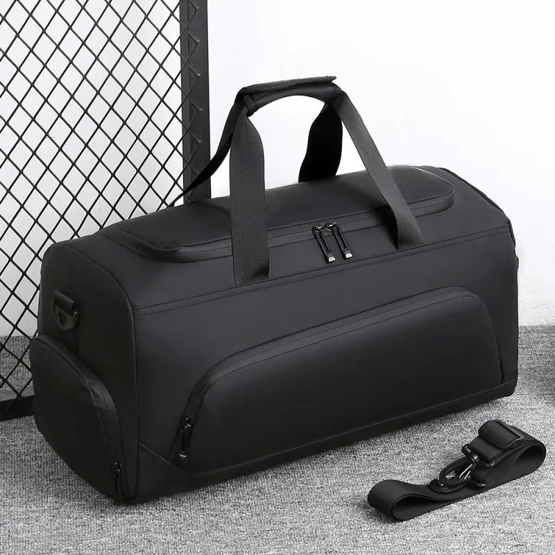 Large black gym and travel duffel bag with handles and shoulder strap