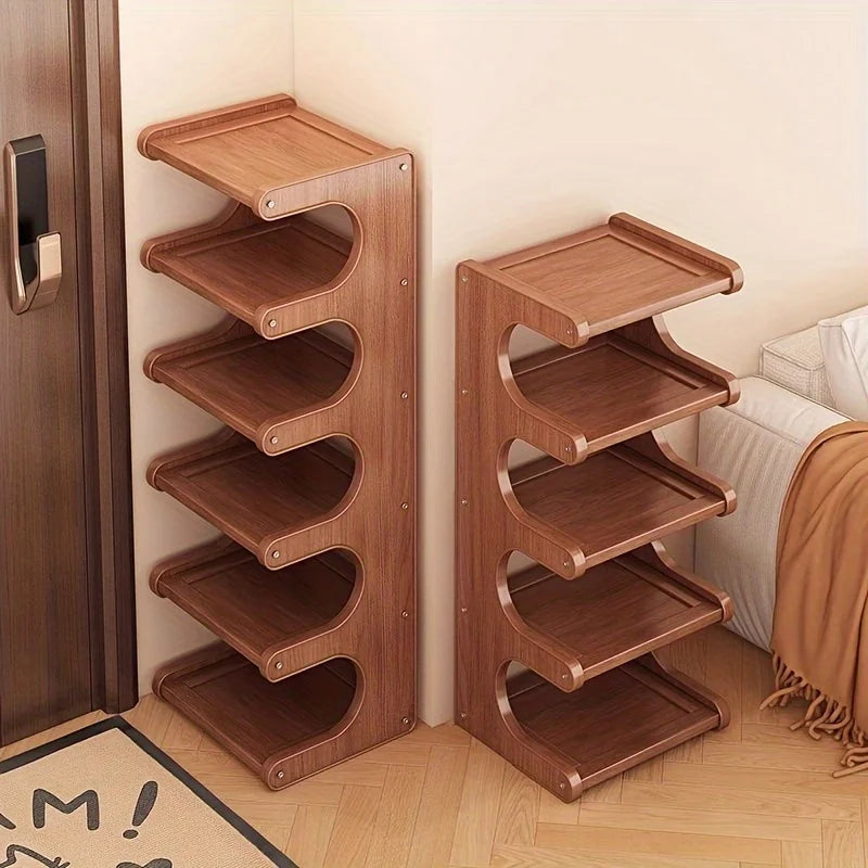 Two empty bamboo-style multi-shelf shoe racks against the wall in a living space