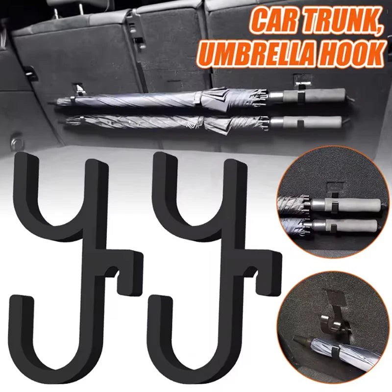 Two black double-hook car trunk umbrella hooks installed holding umbrellas and shown in detail