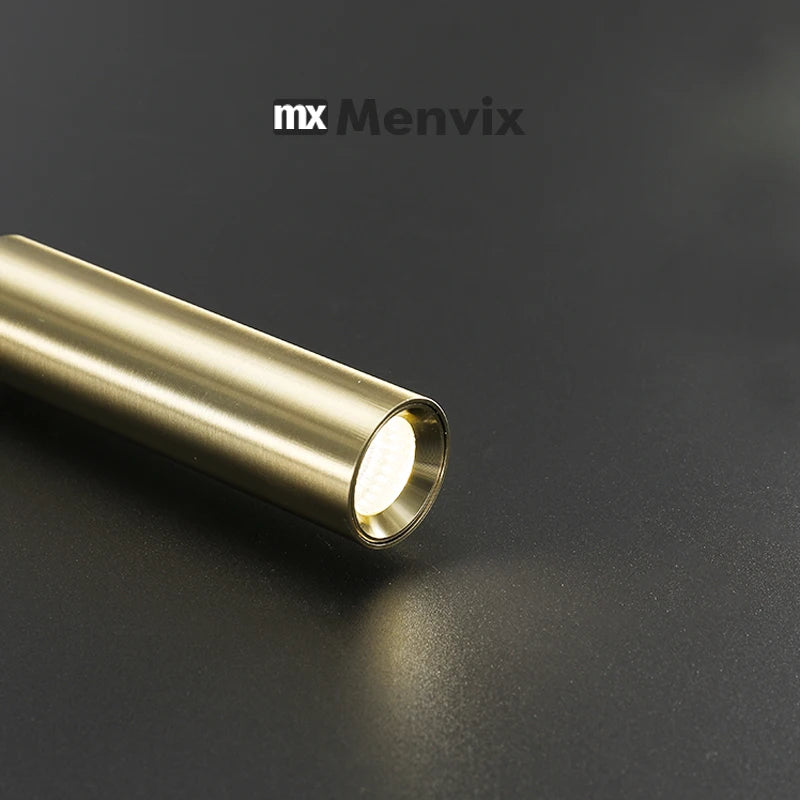 Close up detail of gold LED sconce head showing fine brushed aluminum texture