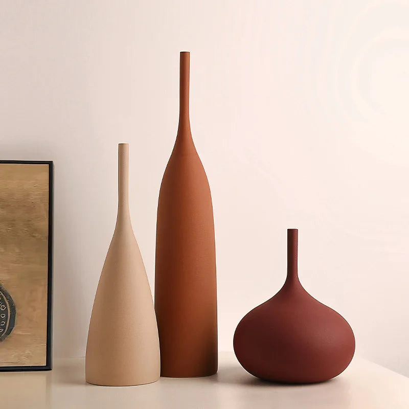 Three Morandi Wabi-Sabi ceramic vases in earth tones on a shelf for living room decor