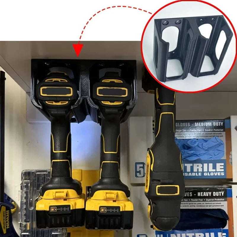 Three cordless drills organized in a wall-mounted tool holder installed beneath a shelf