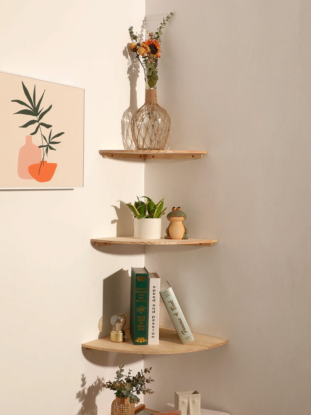 Bright living room view of wall-mounted wood floating corner shelves with books, a vase, and decor displayed
