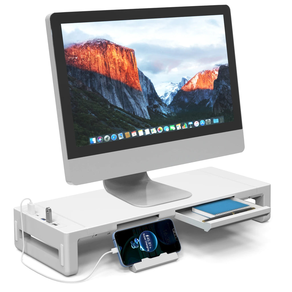 White monitor riser with built-in USB ports and device stand on a desk, holding an iMac and organization items