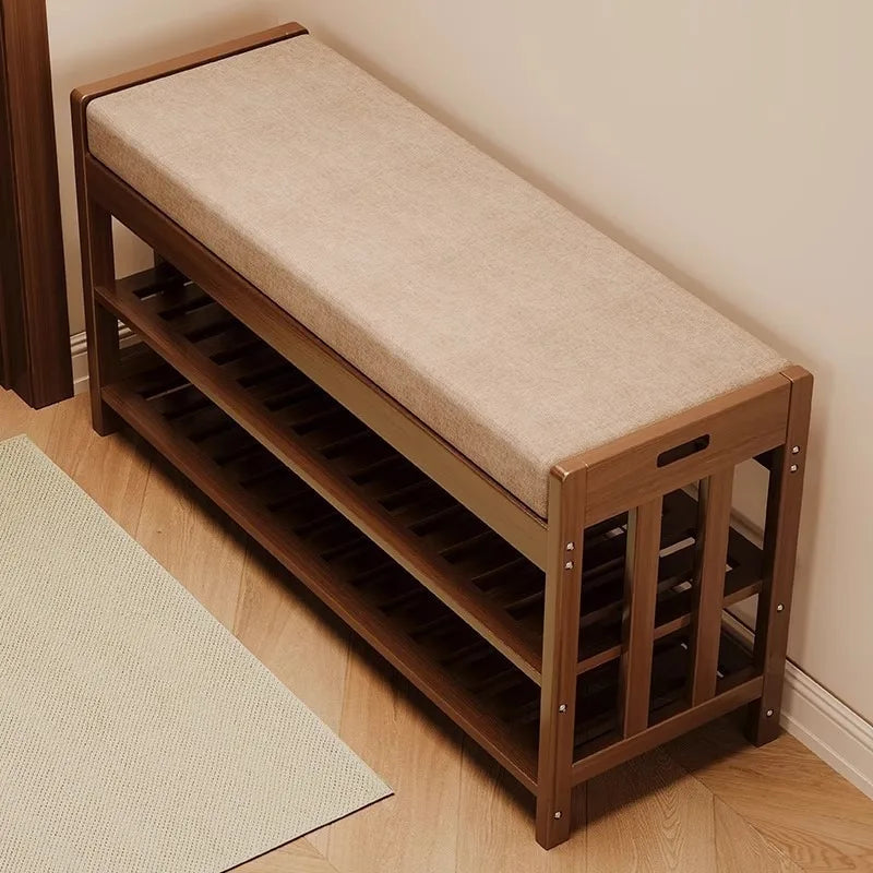 Top view of cushioned shoe bench with wooden frame in a corner of a cozy home