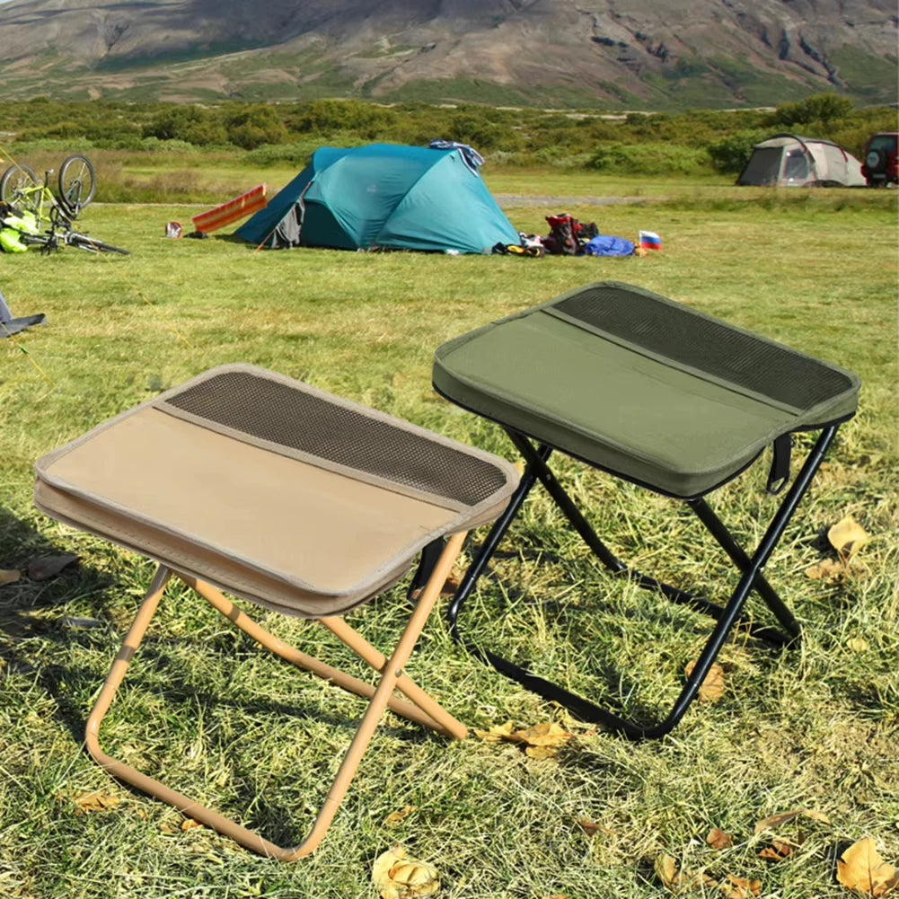 Folding backpack stools arranged on a campsite with tents in the background