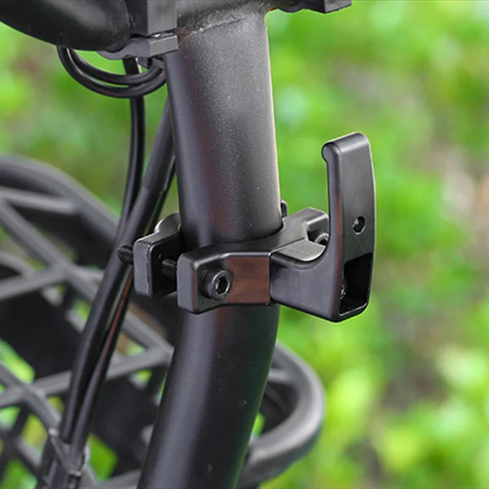 Single hook installed on a bicycle handlebar for hanging items.
