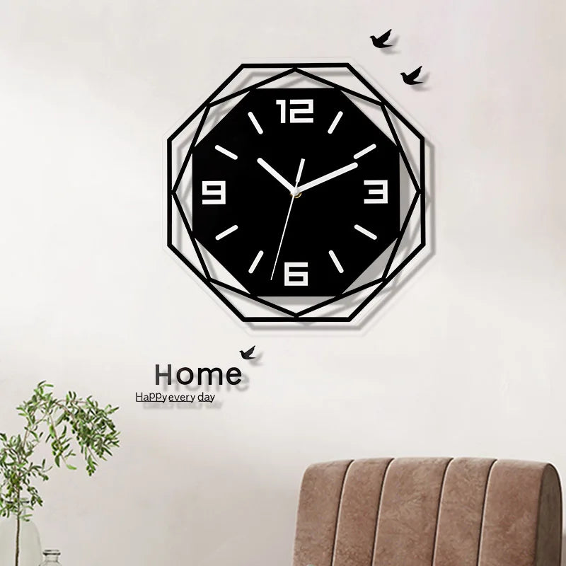 12 inch black geometric wall clock above a chair in a bright, modern room