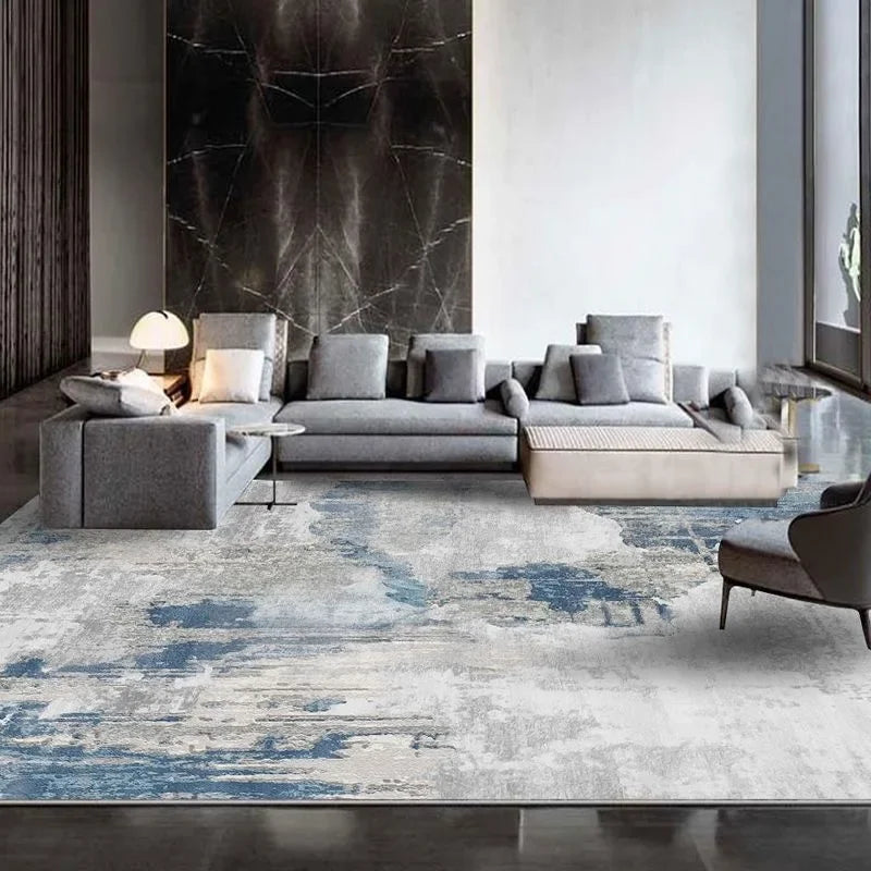 Modern geometric area rug styled in a contemporary living room with a sectional sofa