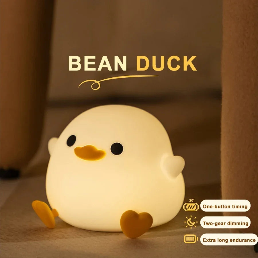 Bean duck silicone night light with text overlay showing timer and dimming features