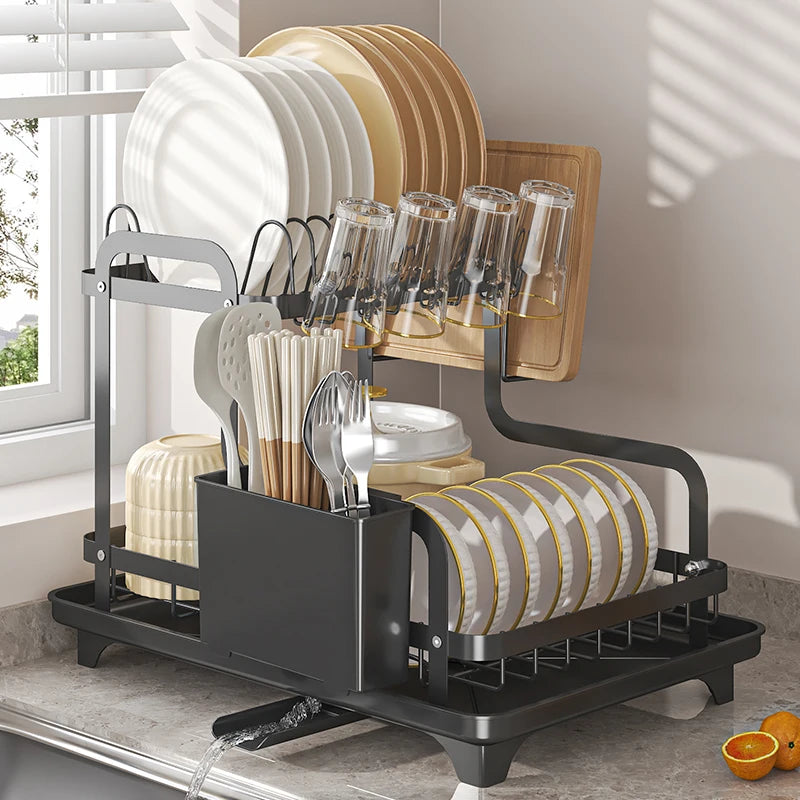 Dish drying rack on kitchen counter showing utensil holder, cup hooks, and draining feature
