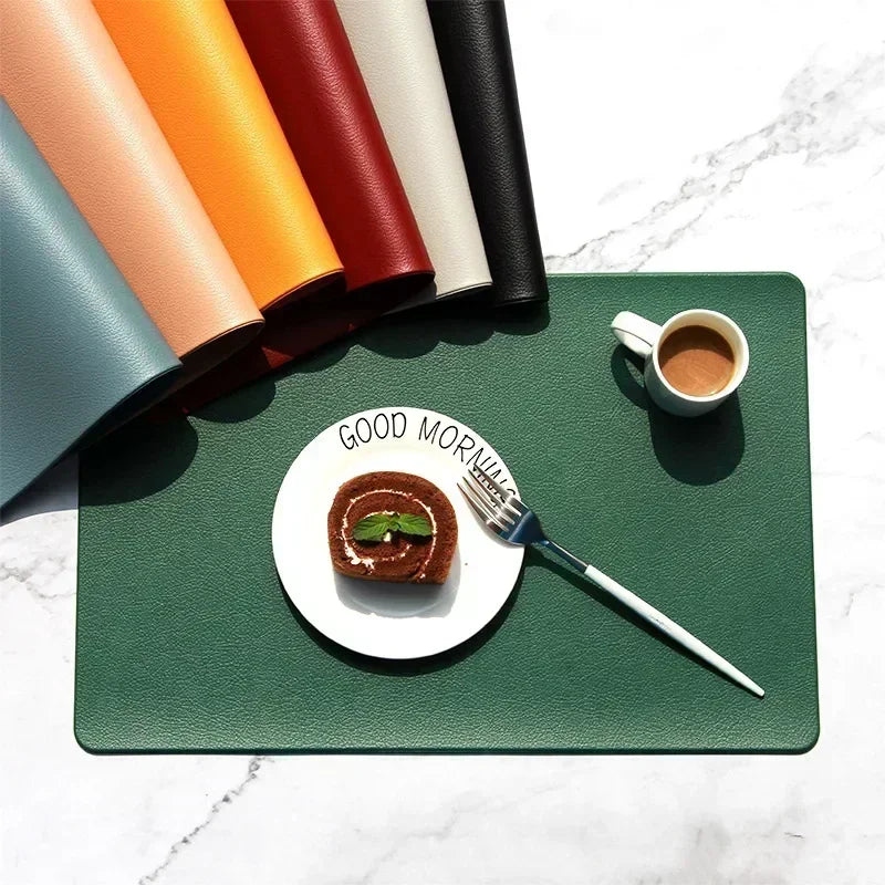 Modern rectangular PVC placemats in assorted colors with a green mat used under a plate and coffee cup