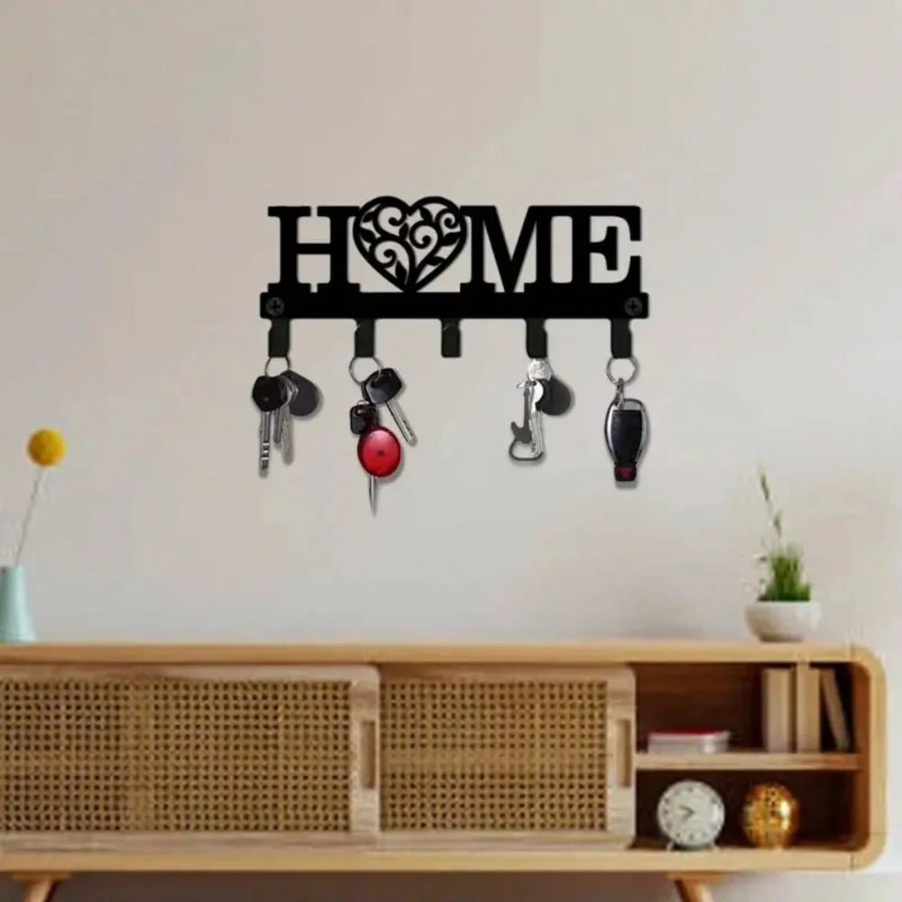 Decorative metal 'HOME' key holder with keys, styled above a rattan console