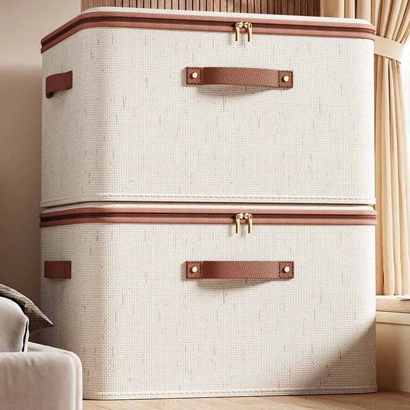 Two beige zippered storage bins stacked together in a bedroom corner