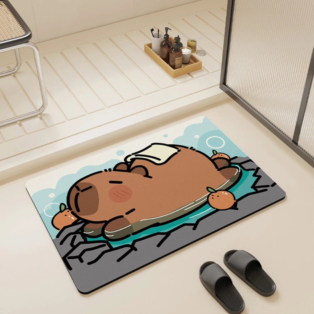 Capybara bath mat placed in a modern bathroom next to black slippers