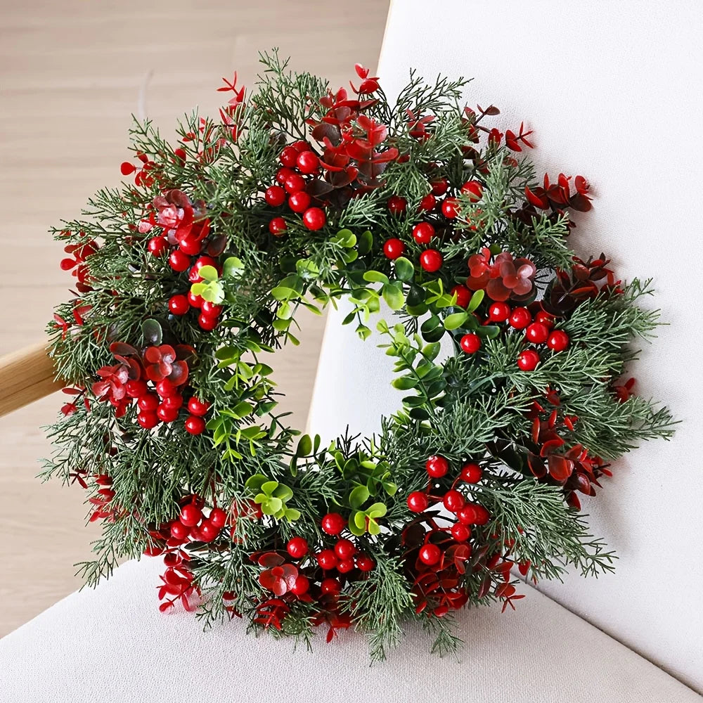 Red berry and evergreen Christmas wreath on white chair, 40cm round