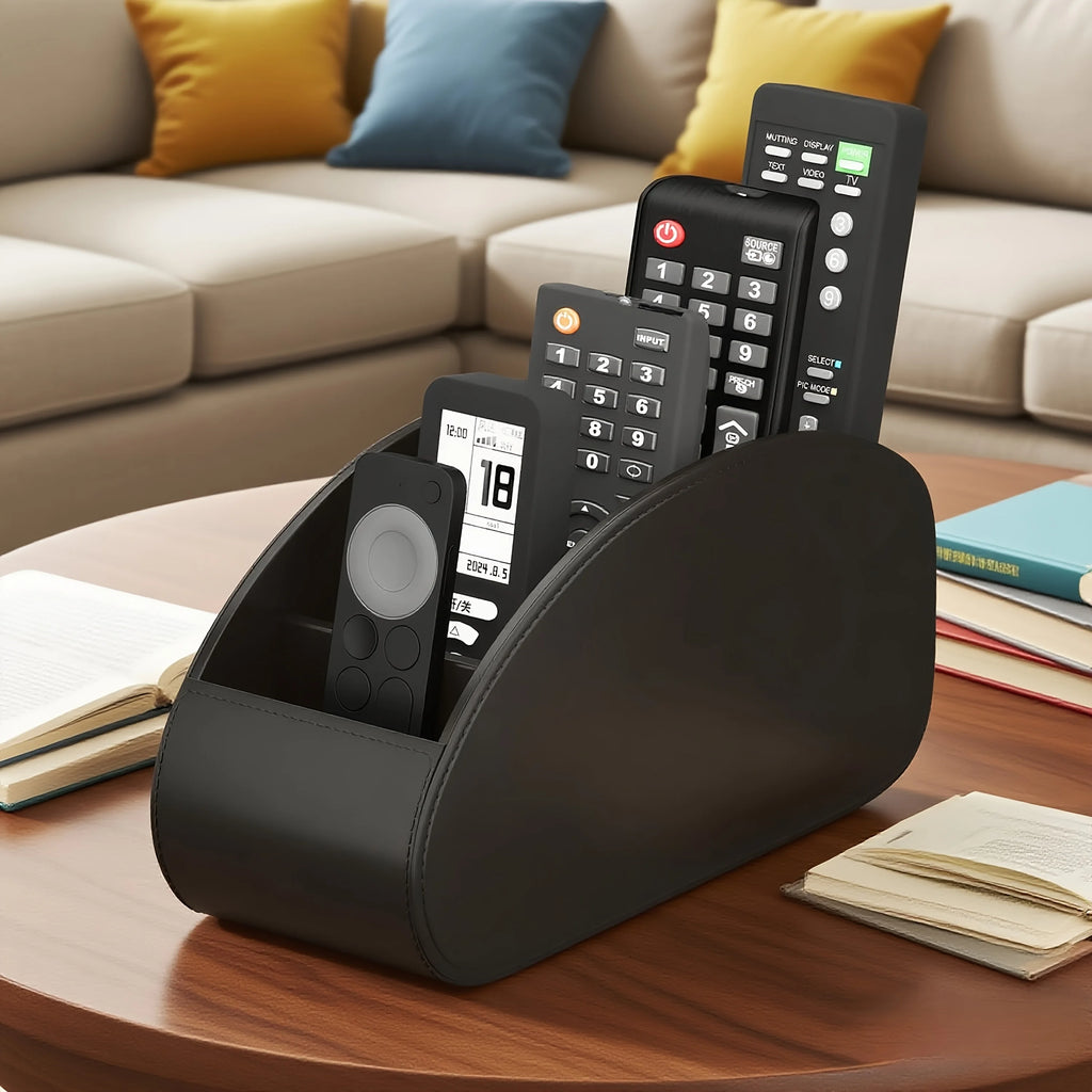 Black remote control organizer caddy holding five remotes on a wooden coffee table in a living room