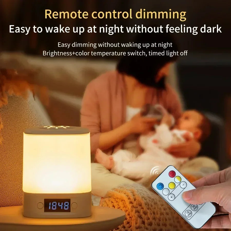 remote control being used to adjust a bedside night light near a parent holding a baby