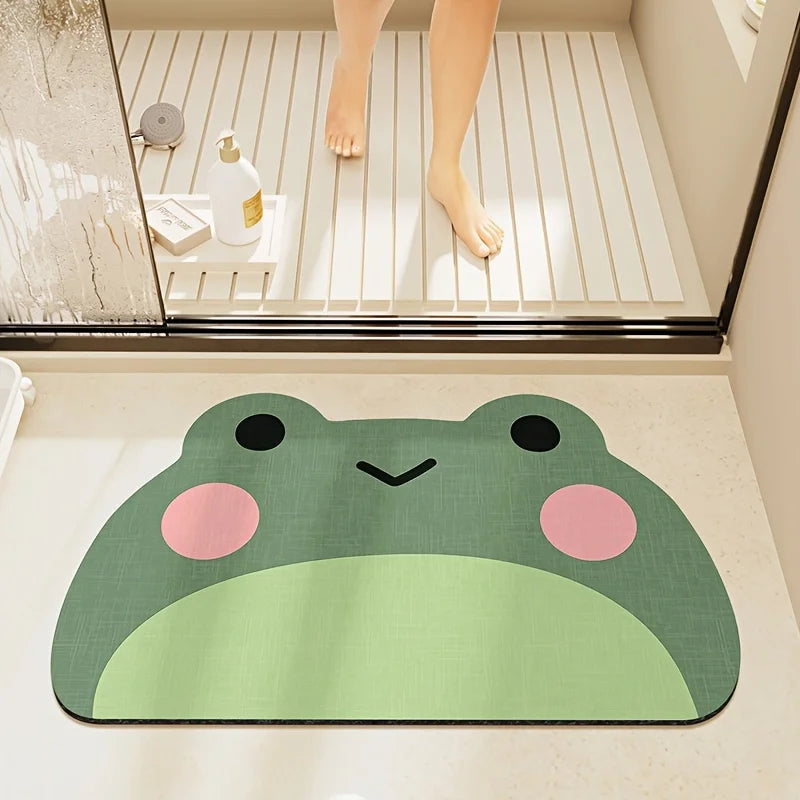 Green frog pattern anti-slip bath mat placed outside a shower