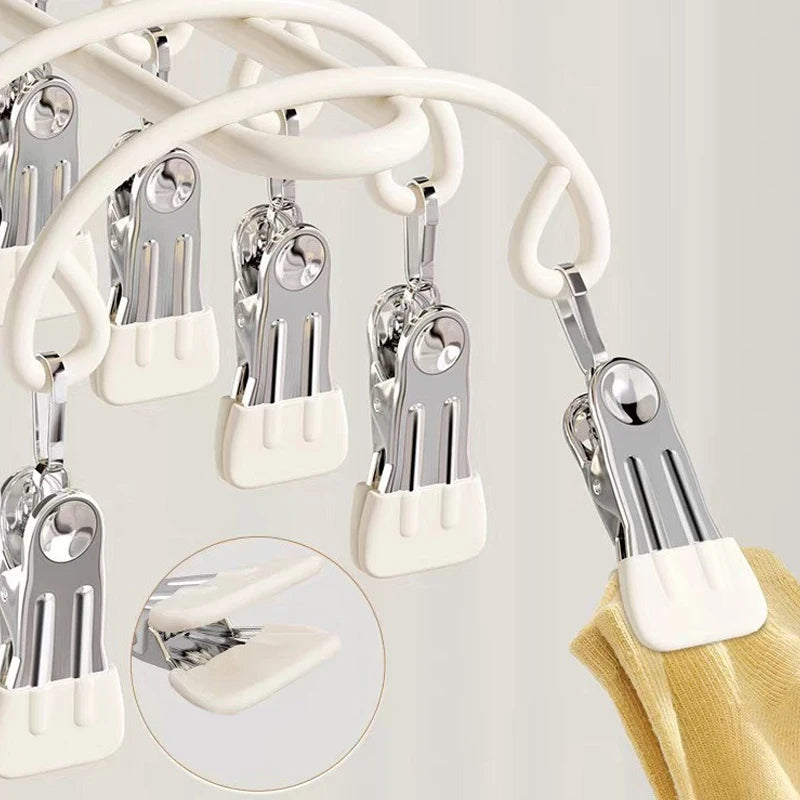 close-up of non-slip clip detail on drying rack holding yellow laundry