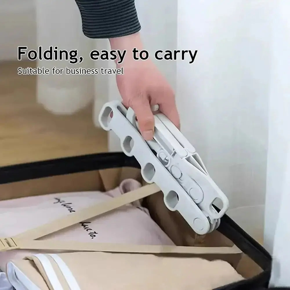 Foldable five-hole drying rack being packed flat into a suitcase