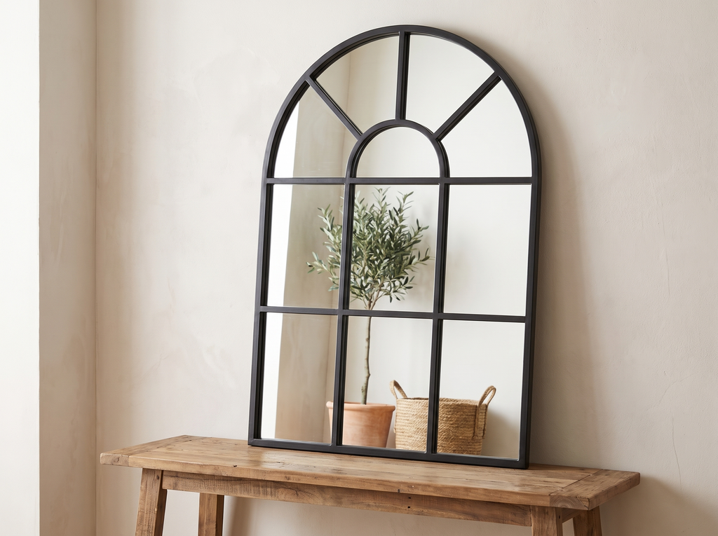 Arched Windowpane Wall Mirror with Black Frame for Entryway or Bedroom in a realistic home setting