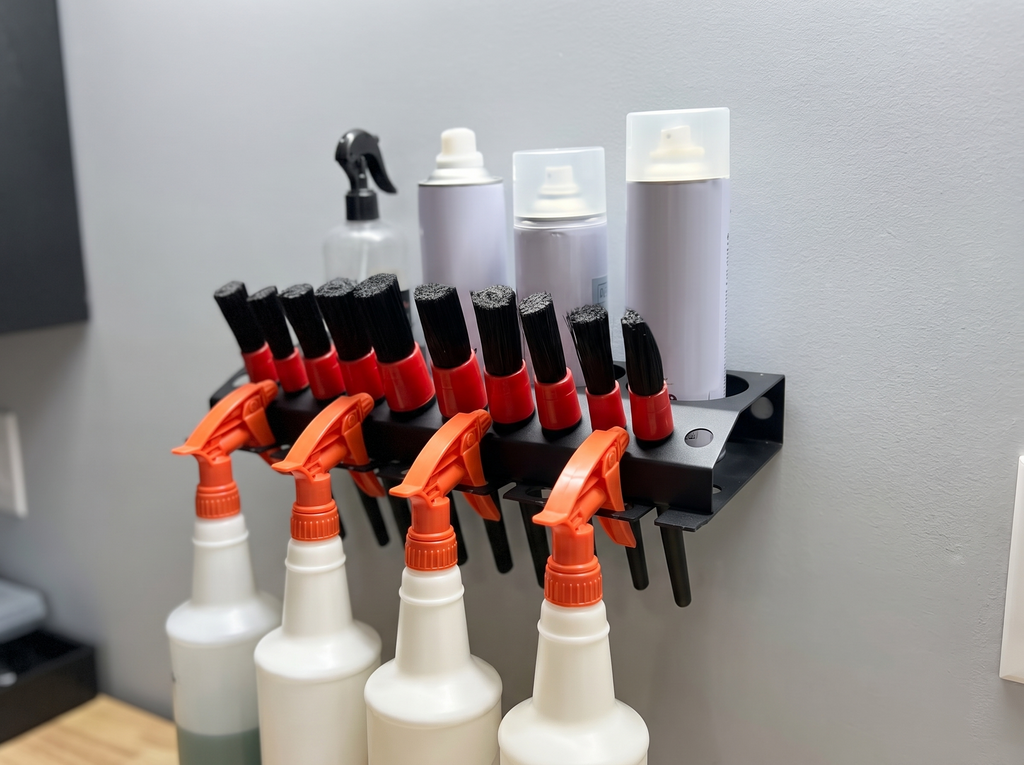 Wall-Mounted Spray Bottle and Tool Organizer Rack for Garage or Utility Room in a realistic home setting