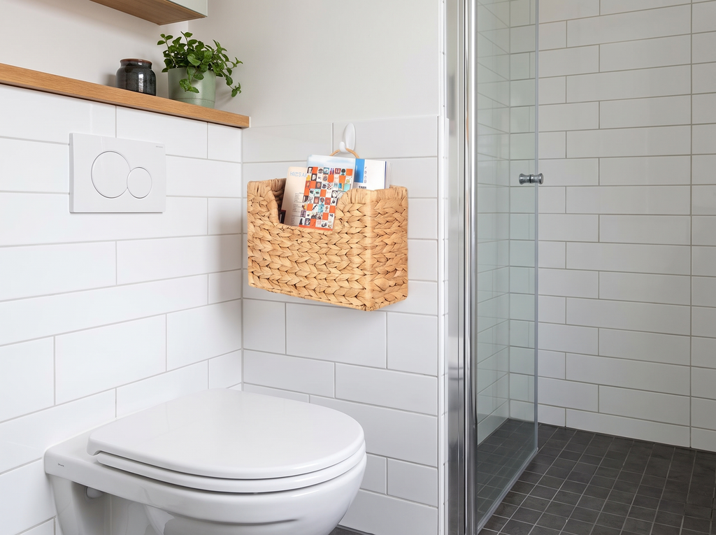 Woven Wall Magazine Holder Basket – Straw Hanging Organizer in a realistic home setting